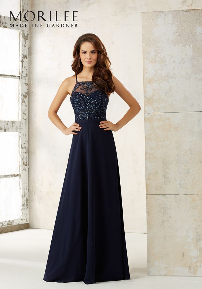 Please all of your girls with navy bridesmaid dresses in an elegant midnight blue hue, whether fitted and floor-length, mid-length or with a statement back