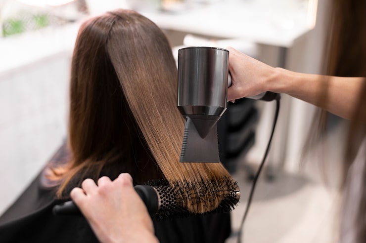 Professional smoothing hair treatment price application process in a local salon.